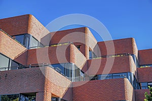 Modern building with red brick wall against blue sky in San Francisco