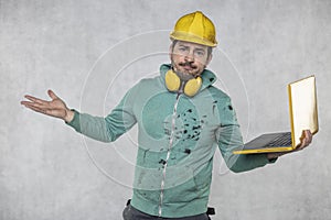 Modern building supervisor keeps the computer in his hands, technology at work