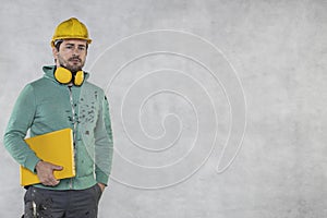 Modern building supervisor keeps the computer in his hands, technology at work