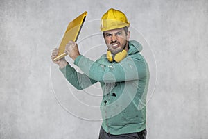 Modern building supervisor keeps the computer in his hands, technology at work