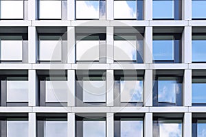 Modern building with tined windows, low angle view photo