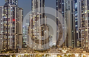 Modern buildings in Dubai city, night scene.