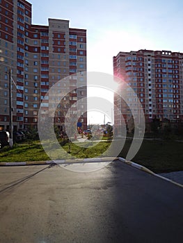 Modern buildings on sunset and sky background