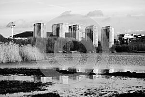 Modern builings at a lake in black an white in Solna, Sweden