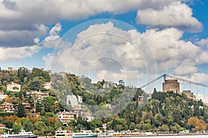 Modern builings and Rumelian Castle, and Fatih Sultan Mehmet Bridge across the Bosphorus strait in Istanbul Turkey from ferry on a