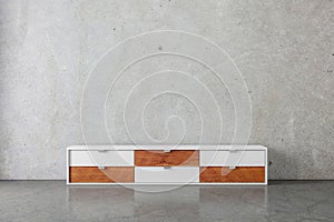 Modern bureau or tv console mockup in empty concrete room