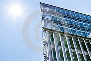 Modern Business buildings with sky background and sun