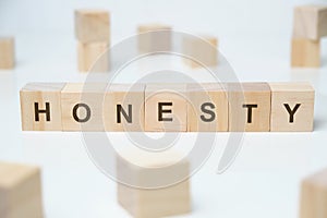 Modern business buzzword - honesty. Word on wooden blocks on a white background