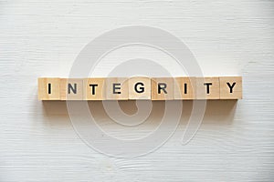Modern business buzzword - integrity . Top view on wooden table with blocks. Top view