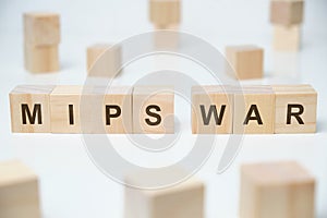 Modern business buzzword - mips war. Word on wooden blocks on a white background