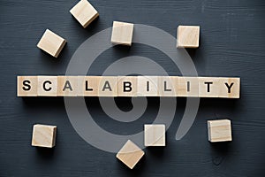 Modern business buzzword - scalability. Top view on wooden table with blocks. Top view