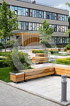 Modern Business Center with green trees, benches