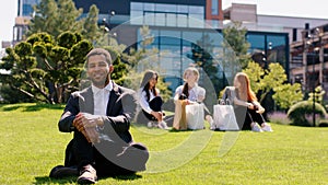 Modern business centre at the lunch time office manger black man posing in front of the camera very charismatic smiling