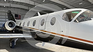 Modern business jet leaves the hangar for departure