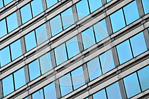 Modern business office building blue glass windows