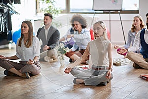 Modern business people meditating together at work.business, meditation concept