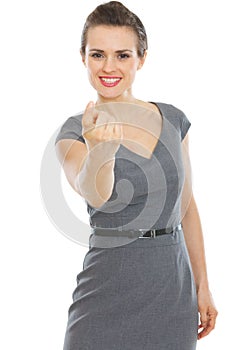 Modern business woman beckoning with finger