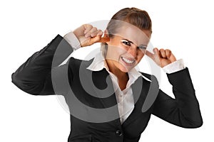 Modern business woman closing ears with fingers