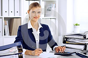 Modern business woman or confident female accountant in office