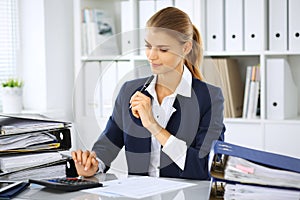 Modern business woman or confident female accountant in office. Student girl during exam preparing. Audit, tax service