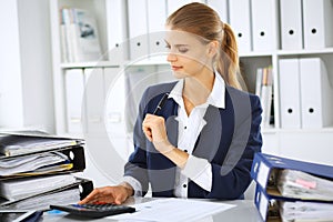 Modern business woman or confident female accountant in office. Student girl during exam preparing. Audit, tax service