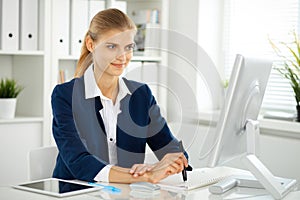 Modern business woman or confident female accountant in office. Student girl during exam preparing. Audit, tax service