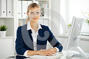 Modern business woman or confident female accountant in office. Student girl during exam preparing. Audit, tax service