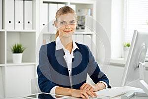 Modern business woman or confident female accountant in office. Student girl during exam preparing. Audit, tax service