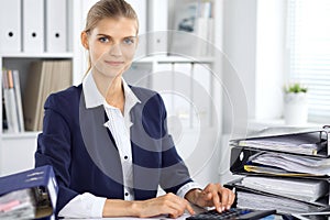 Modern business woman or confident female accountant in office. Student girl during exam preparing. Audit, tax service