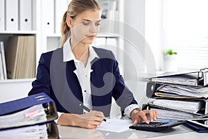 Modern business woman or confident female accountant in office. Student girl during exam preparing. Audit, tax service