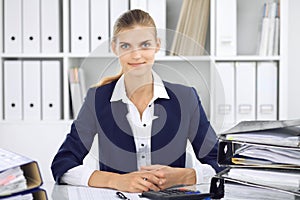 Modern business woman or confident female accountant in office. Student girl during exam preparing. Audit, tax service