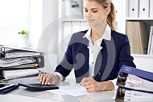 Modern business woman or confident female accountant in office. Student girl during exam preparing. Audit, tax service