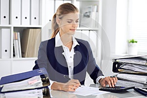 Modern business woman or confident female accountant in office. Student girl during exam preparing. Audit, tax service