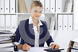 Modern business woman or confident female accountant in office. Student girl during exam preparing. Audit, tax service