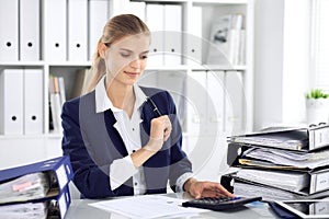 Modern business woman or confident female accountant in office. Student girl during exam preparing. Audit, tax service