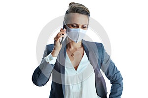 Modern business woman in grey suit on using phone