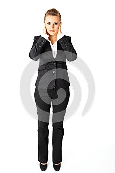 Modern business woman with hand on ears