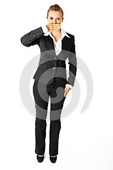 Modern business woman with hand on mouth