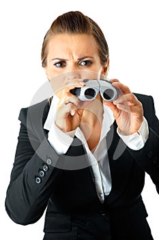 Modern business woman looking through binoculars