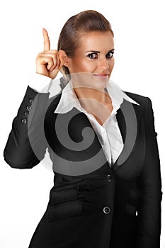 Modern business woman with rised finger. idea gest photo