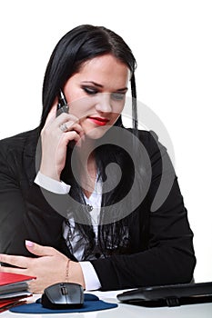 Modern business woman talking phone sitting at office desk