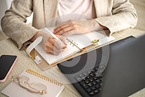 Modern business woman working online use laptop making notes e learning distance education at home