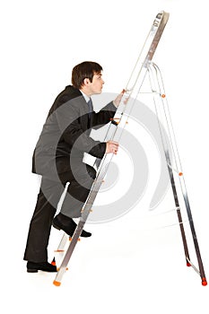 Modern businessman climbing upwards up on ladder