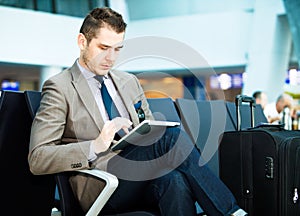 Modern businessman using tablet computer