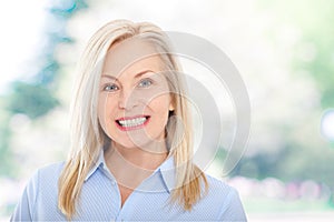 Modern businesswoman. Beautiful middle aged woman looking at camera.