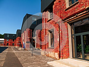 Modern cafe workspace exterior loft style red brick wall Old industrial buildings renovation Urban space Break-out areas