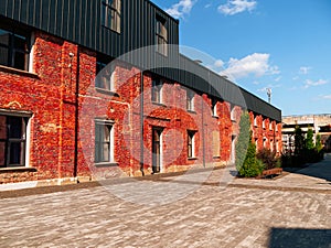 Modern cafe workspace exterior loft style red brick wall Old industrial buildings renovation Urban space Break-out areas