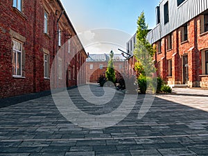 Modern cafe workspace exterior loft style red brick wall Old industrial buildings renovation Urban space Break-out areas