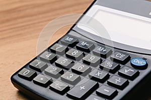 Modern calculator, Business and Finance accounting concept on wooden table