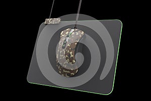 Modern camouflage gaming mouse on professional pad on black with clipping path